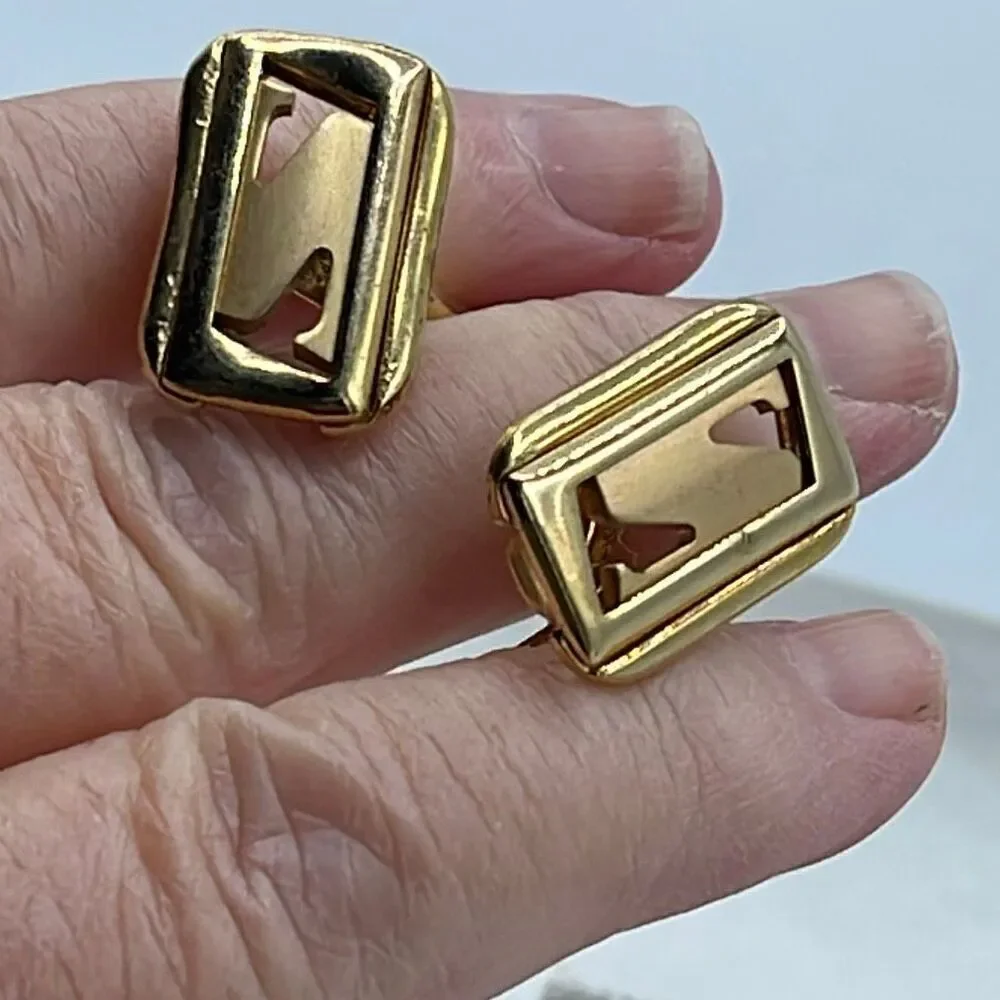 Vintage Anson gold tone shiny matte open design cufflinks.